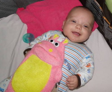 Theo loves his pinky hippo